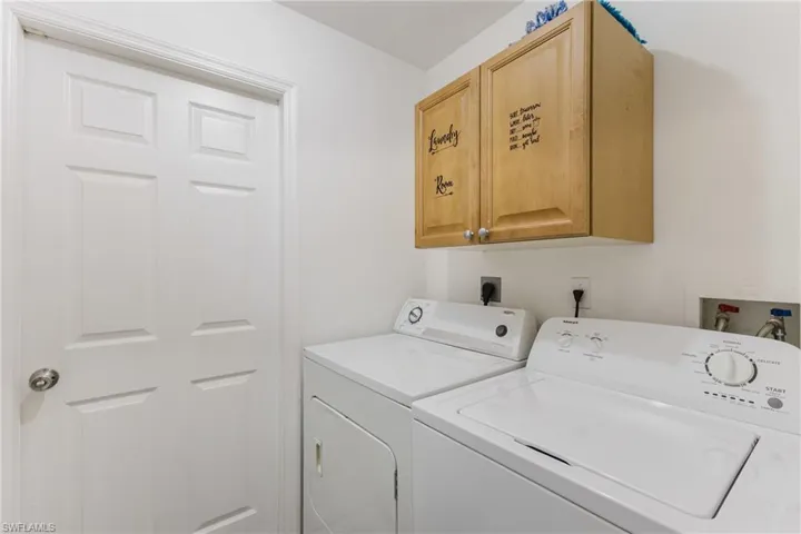 Laundry area with washer and dryer and cabinet space