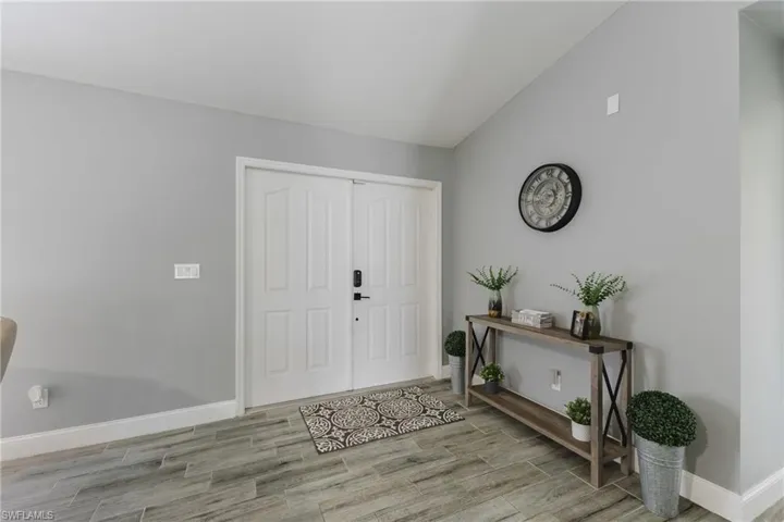 Foyer featuring wood tiled floors