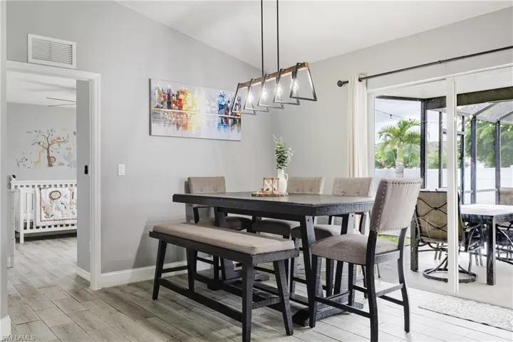 Dining room with light wood-style flooring