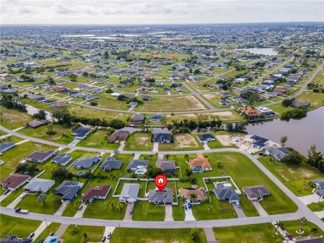 View of property location with nearby suburban area and a large body of water