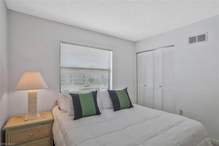 Guest Bedroom with a closet and full bath steps outside the door