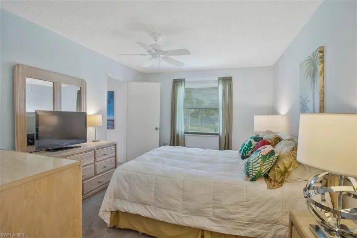 Master bedroom with two windows and ensuite bath and walk in closet
