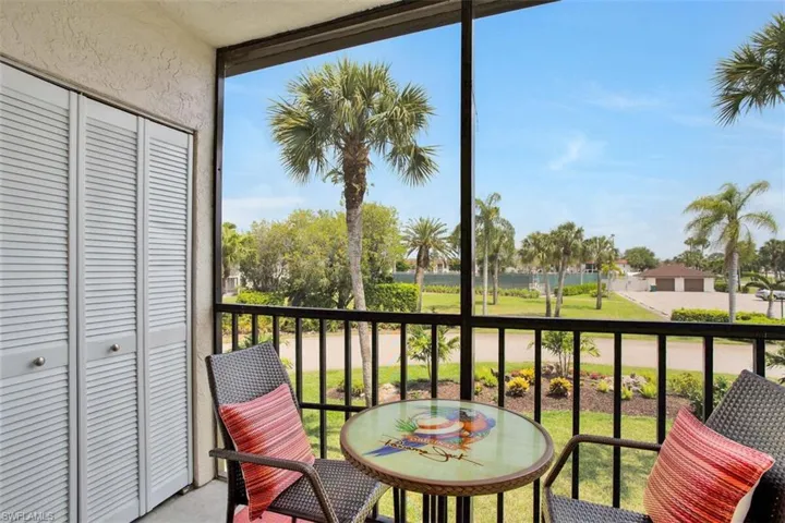 View of balcony with  washer/dryer closet
