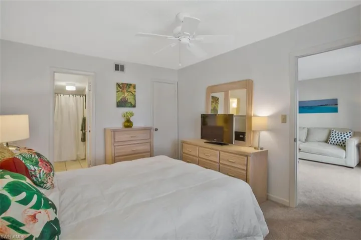 Master bedroom with walk in closet and step in shower