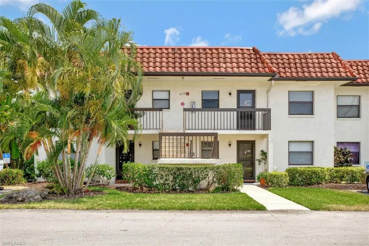 View of front of home with an open air  balcony