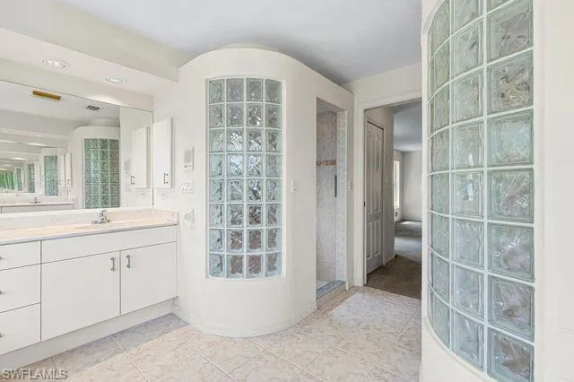 Bathroom featuring vanity and tile patterned flooring