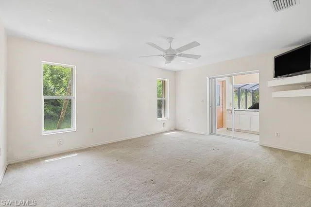 Masterbedroom room featuring ceiling fan and carpet flooring
