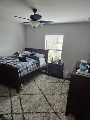Bedroom featuring a ceiling fan
