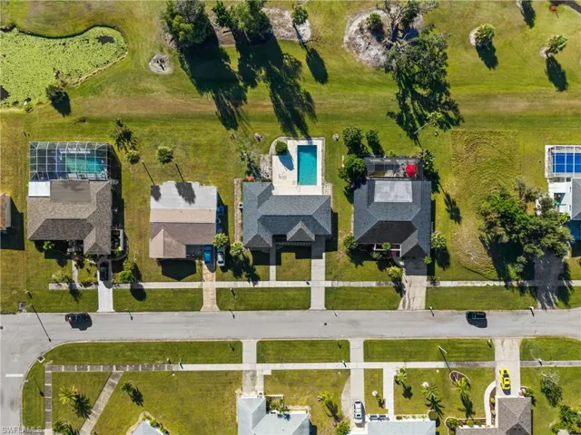 Aerial view of property's location featuring a pool