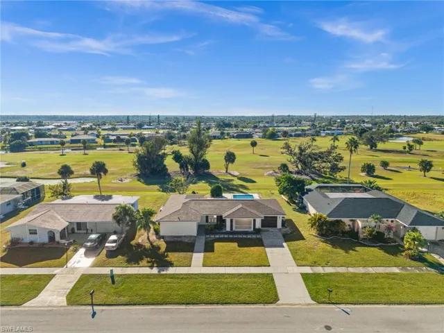 Aerial view of residential area with a golf club