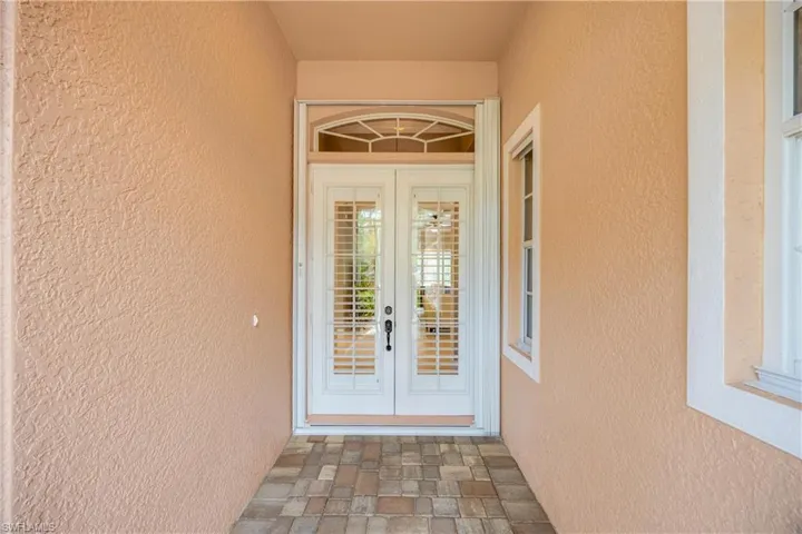 Doorway to property featuring french doors