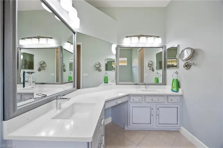 Bathroom featuring tile patterned floors and vanity