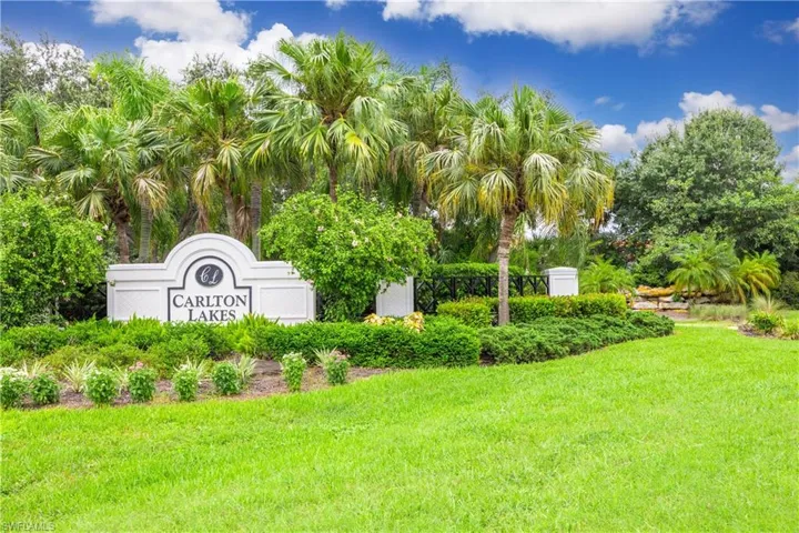Community / neighborhood sign with a lawn