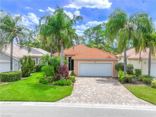 View of front facade with a garage and a front yard