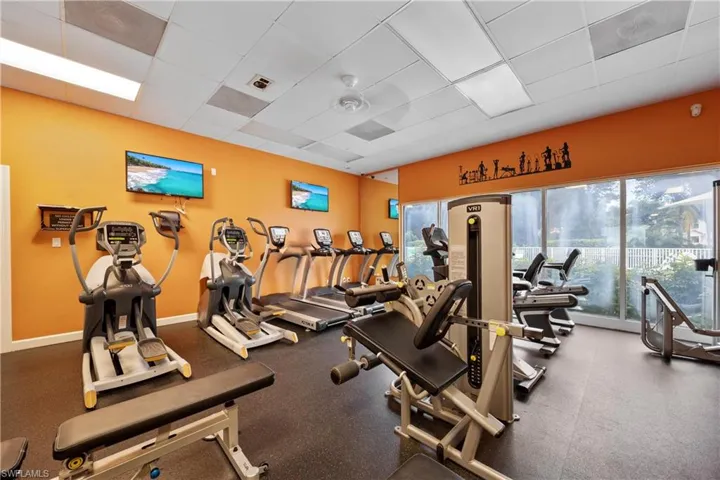 Gym with a paneled ceiling