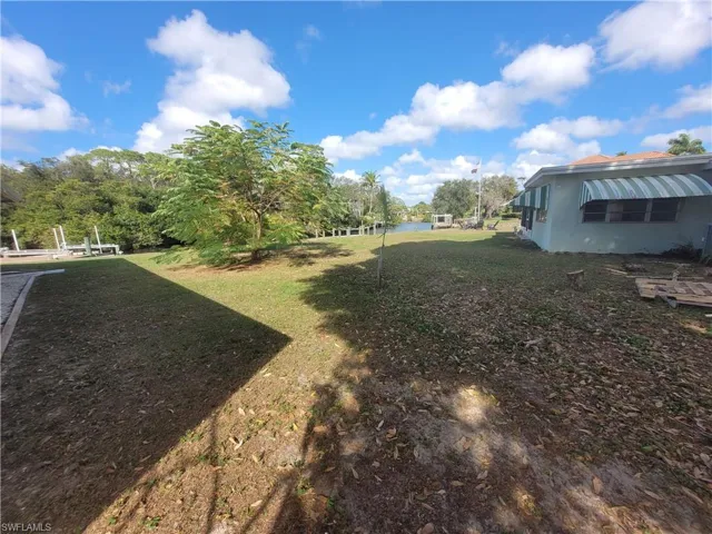 View of grassy yard featuring a water view