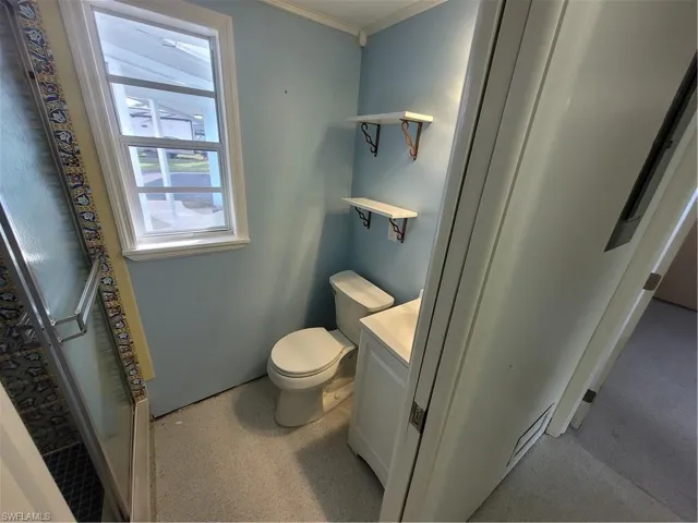 Full bathroom featuring vanity and a stall shower