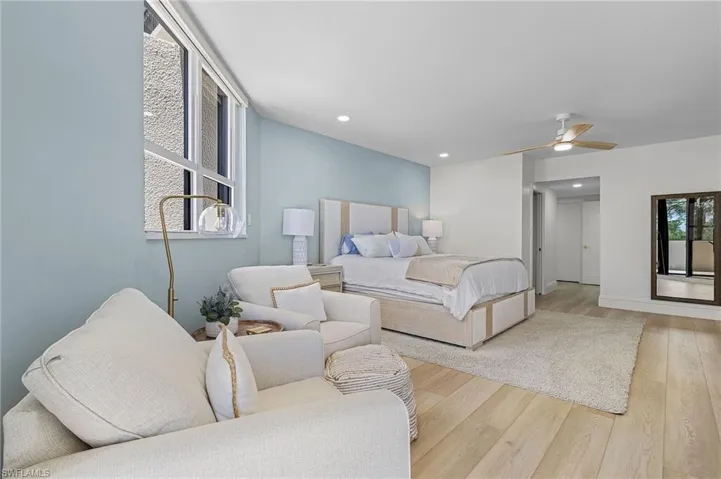 Bedroom featuring light hardwood / wood-style flooring and ceiling fan