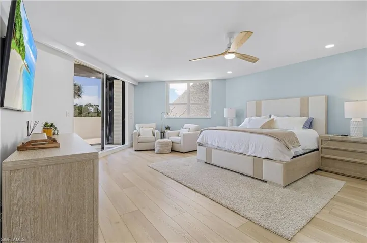 Bedroom with light hardwood / wood-style floors and ceiling fan