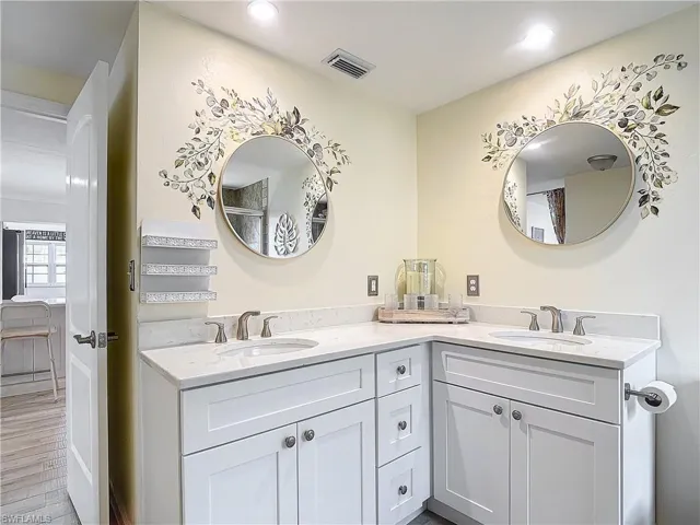 Bathroom featuring vanity and hardwood / wood-style floors