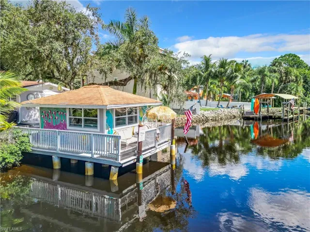 View of dock featuring a deck with water view