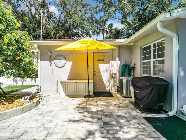 Outside shower and door leading into laundry room/half bathroom