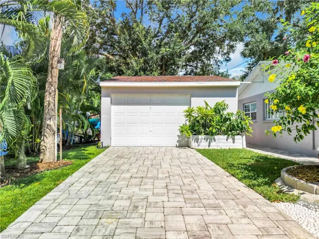 Interlocking pavers going out from back garage door to boat ramp/river