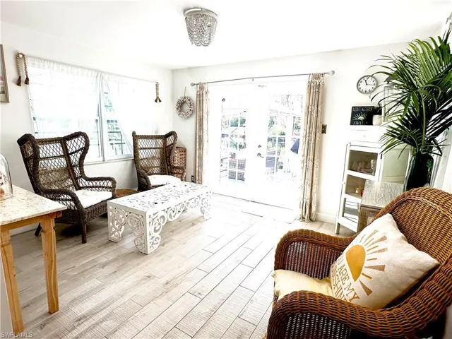 Sitting room featuring light hardwood / wood-style floors, french doors, and plenty of natural light