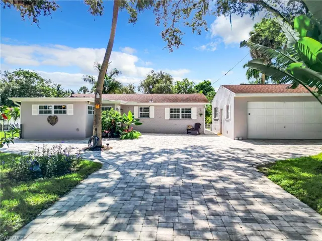 View of front of house featuring a double car garage