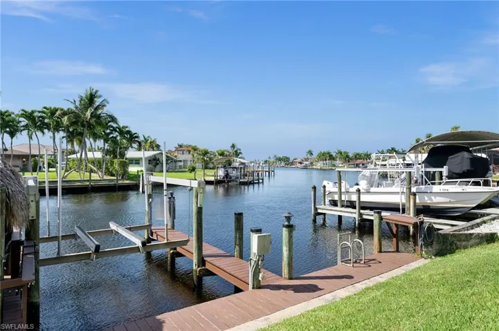 Your private Dock and Lift next to the Tiki.