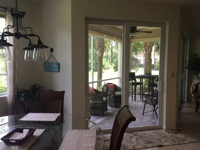 Dining space with a ceiling fan and a chandelier