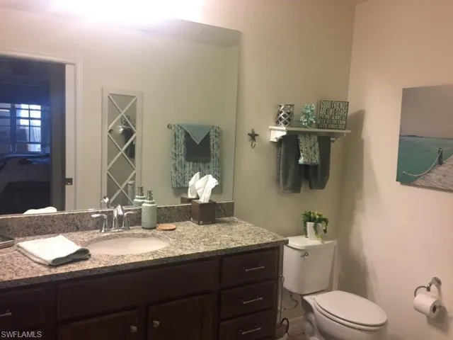 Bathroom with vanity and toilet
