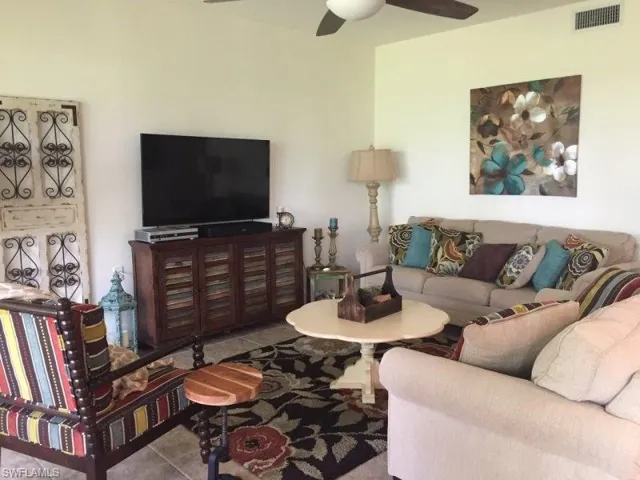 Tiled living area with a ceiling fan