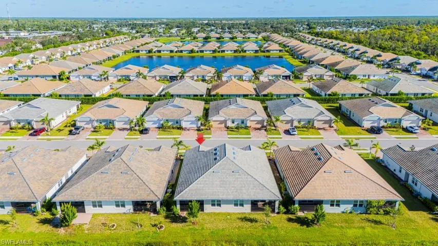 Aerial view of residential area with a large body of water