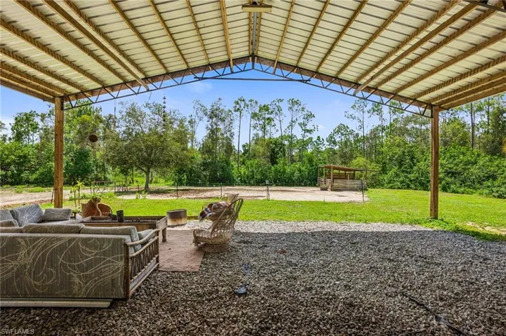 View of patio / terrace featuring view of wooded area