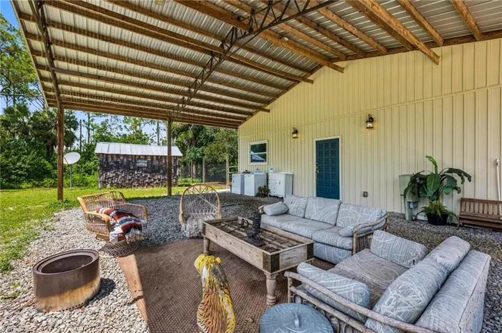 View of patio / terrace featuring an outdoor hangout area and washer and clothes dryer