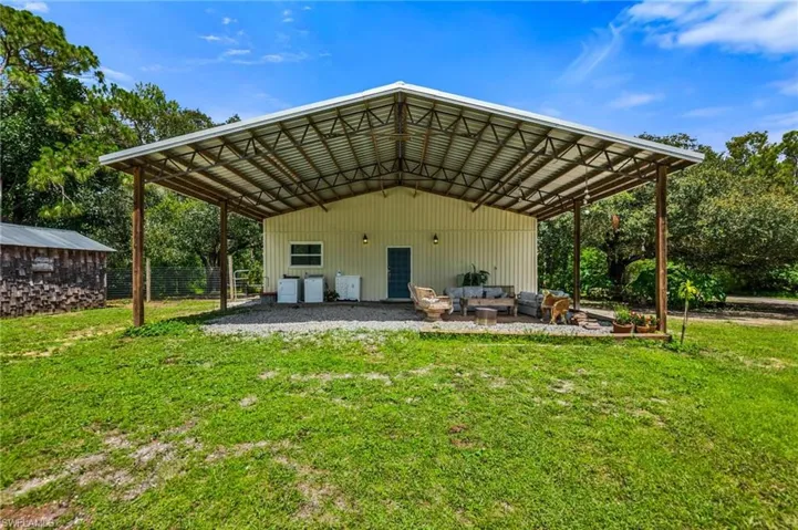 View of parking featuring a carport