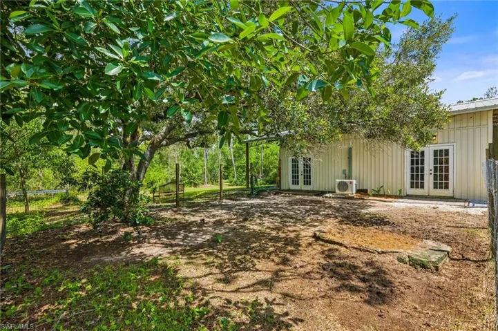 View of yard with french doors