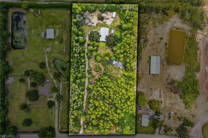 Aerial view of property's location featuring property parcel outlined
