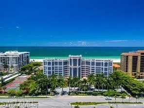 Bird's eye view of a nearby body of water and apartment complex / building