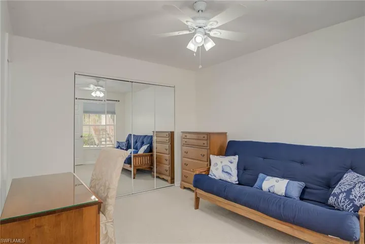 Carpeted office with ceiling fan