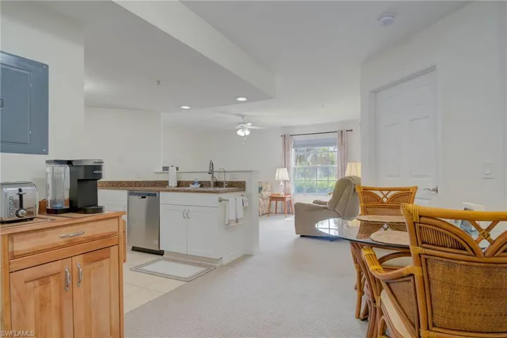Kitchen with dishwasher, ceiling fan, recessed lighting, open floor plan, and butcher block countertops