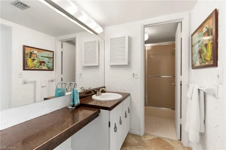 Large vanity area and separate from shower