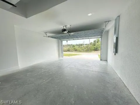 Garage featuring a garage door opener