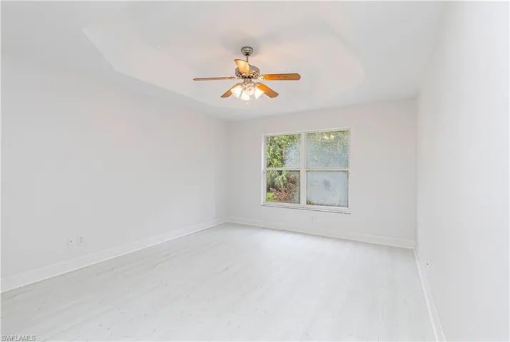 Master bedroom with  a coffered ceiling, 2 walk in closets