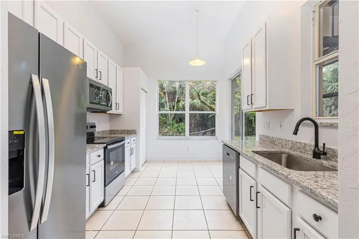 Eat in Kitchen with all new  appliances and new sink, faucet and new counters  - plenty of natural light