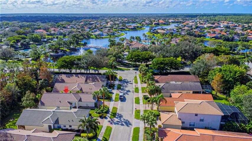 Bird's eye view with a water view & walk to clubhouse