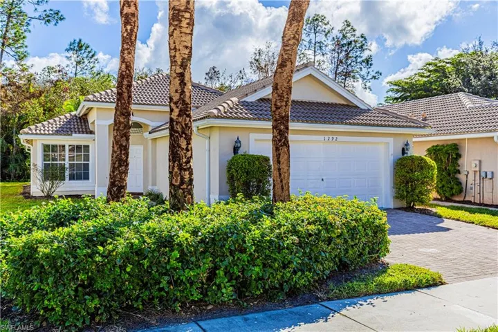 Front of homes featuring beautiful Palm Trees
