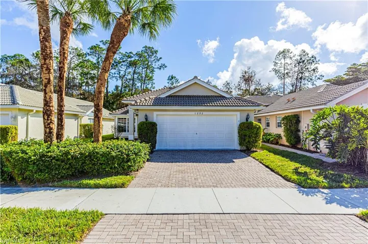 Driveway featuring a 2 car  garage