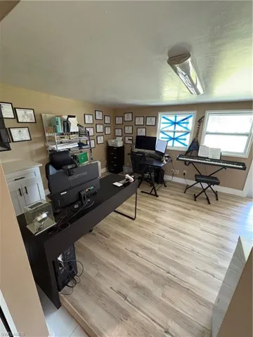 Office space with light wood-type flooring